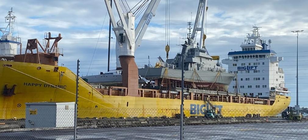 The retired patrol boats Rotoiti and Pukaki from the Royal New Zealand Navy are being lifted onto a large vessel for transfer to Ireland
